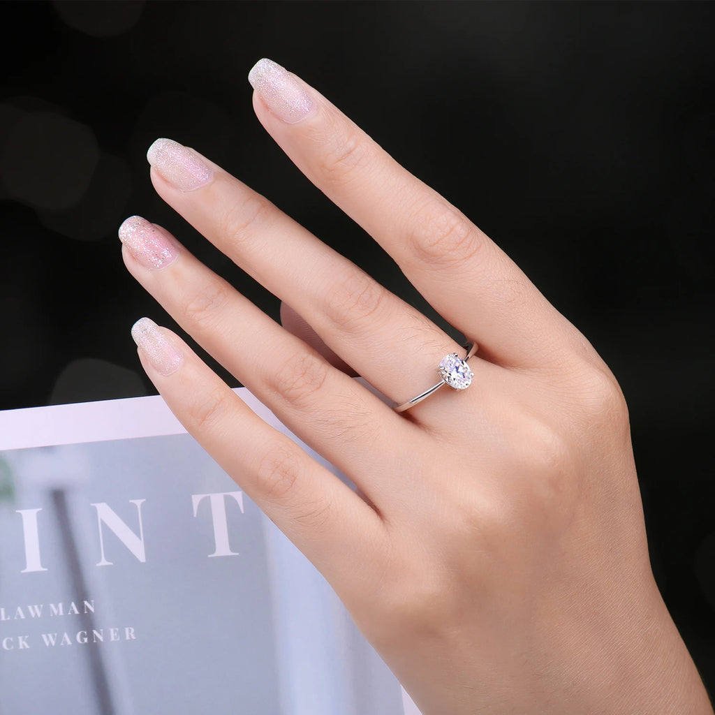 A classic and luxurious engagement ring in 925 sterling silver, set with an oval cubic zirconia stone, from Mila Jewelry for women, an anniversary gift, fine jewelry.